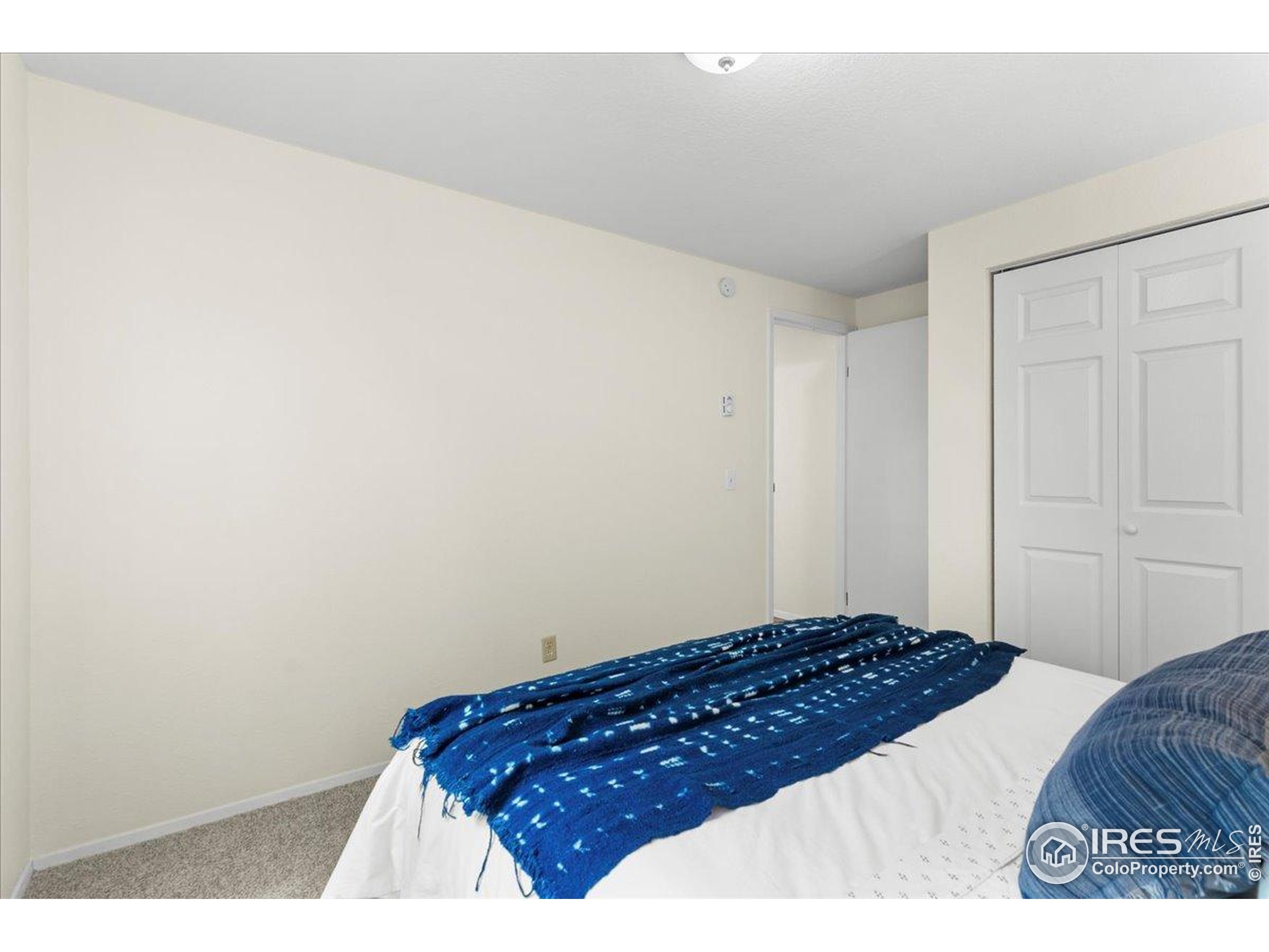 1204 Pomona Street, Unit S & T Fort Collins, CO 80521 - Photo 24 of 40 a bedroom with a bed and a lamp