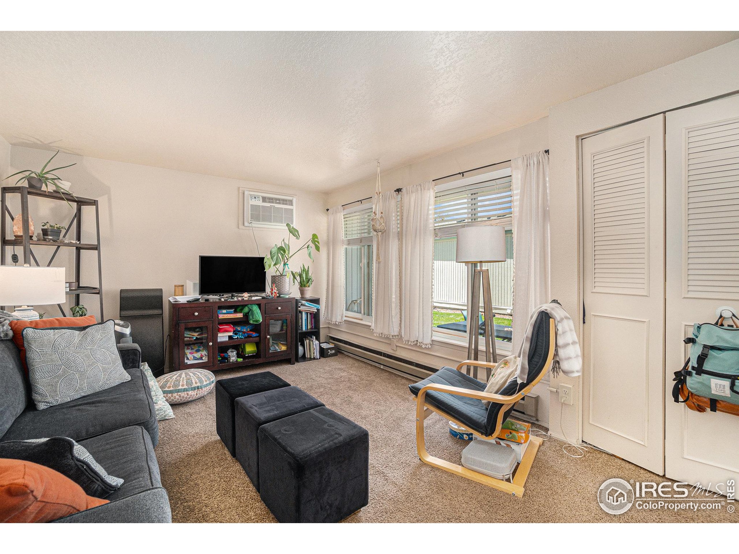 1204 Pomona Street, Unit S & T Fort Collins, CO 80521 - Photo 28 of 40 a living room with furniture and a flat screen tv