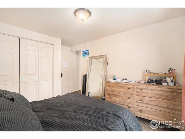 a kitchen with granite countertop cabinets stainless steel appliances and a counter space