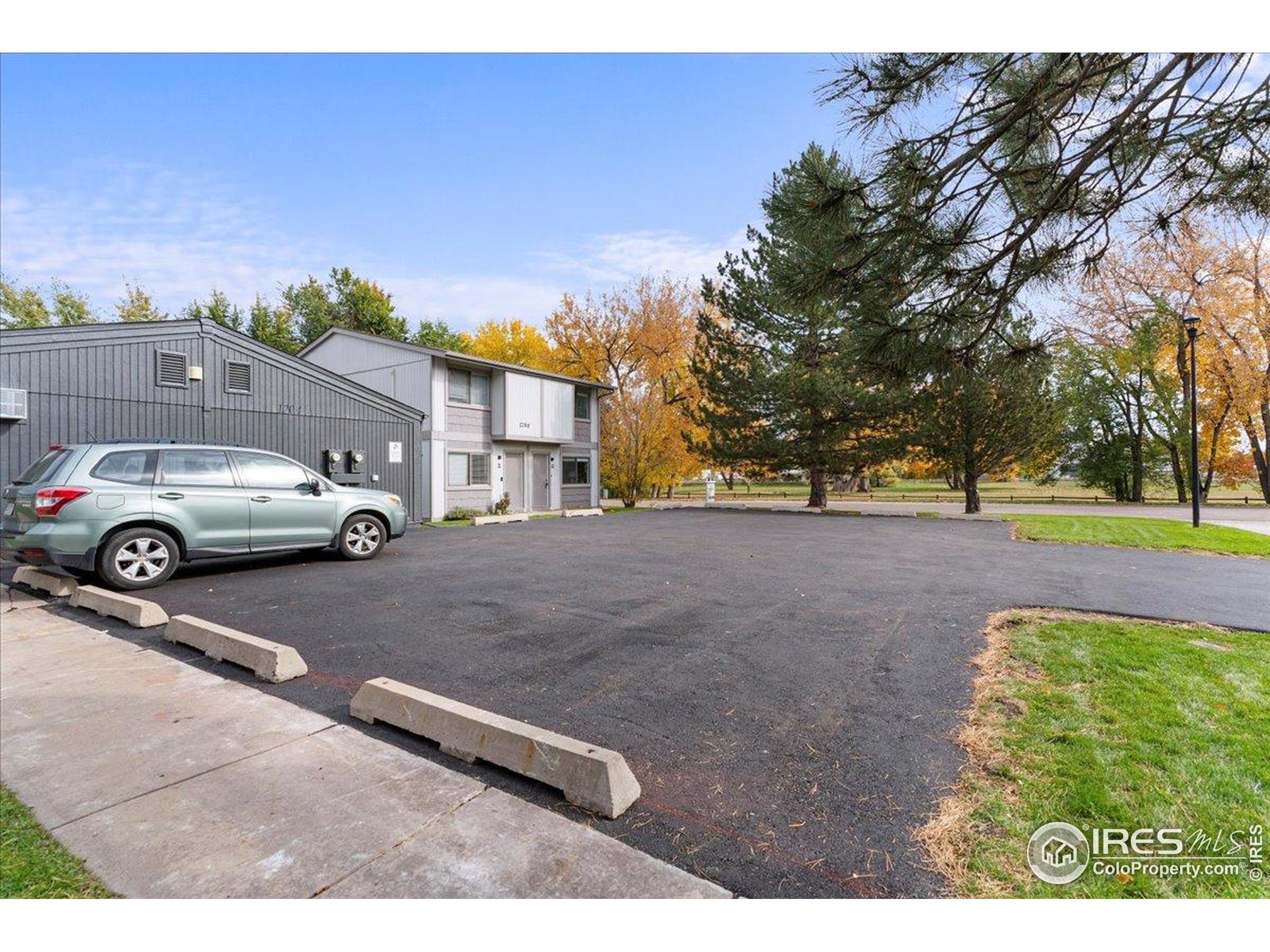 1204 Pomona Street, Unit S & T Fort Collins, CO 80521 - Photo 37 of 40 a view of a city street with a car parked on the road