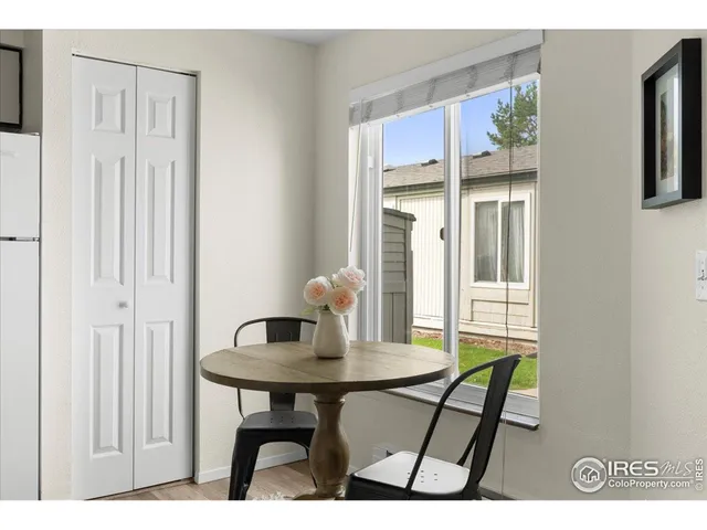 a dining room with furniture and window