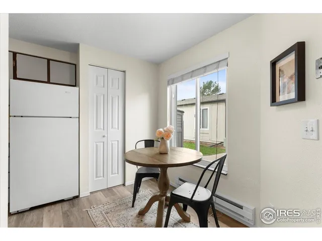 a living room with furniture a window and a table