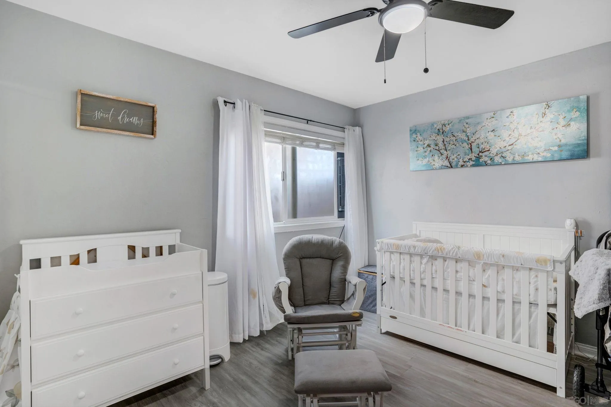 575 7th Street, Unit 104 Imperial Beach, CA 91932 - Photo 12 of 23 a bedroom with furniture and a window