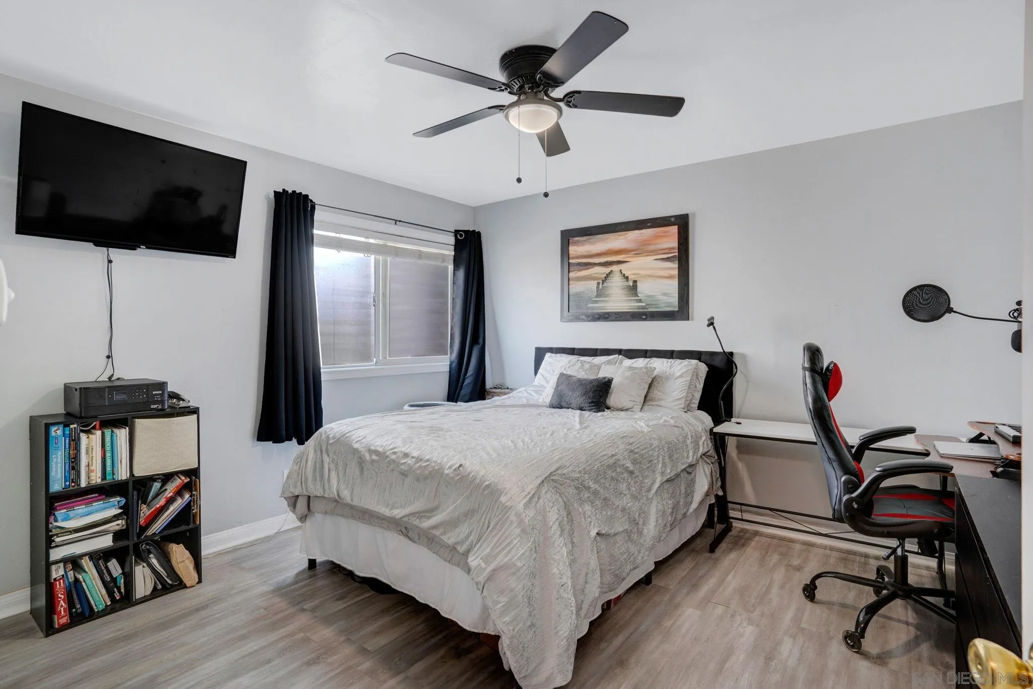 575 7th Street, Unit 104 Imperial Beach, CA 91932 - Photo 13 of 23 a bedroom with a bed and a flat screen tv