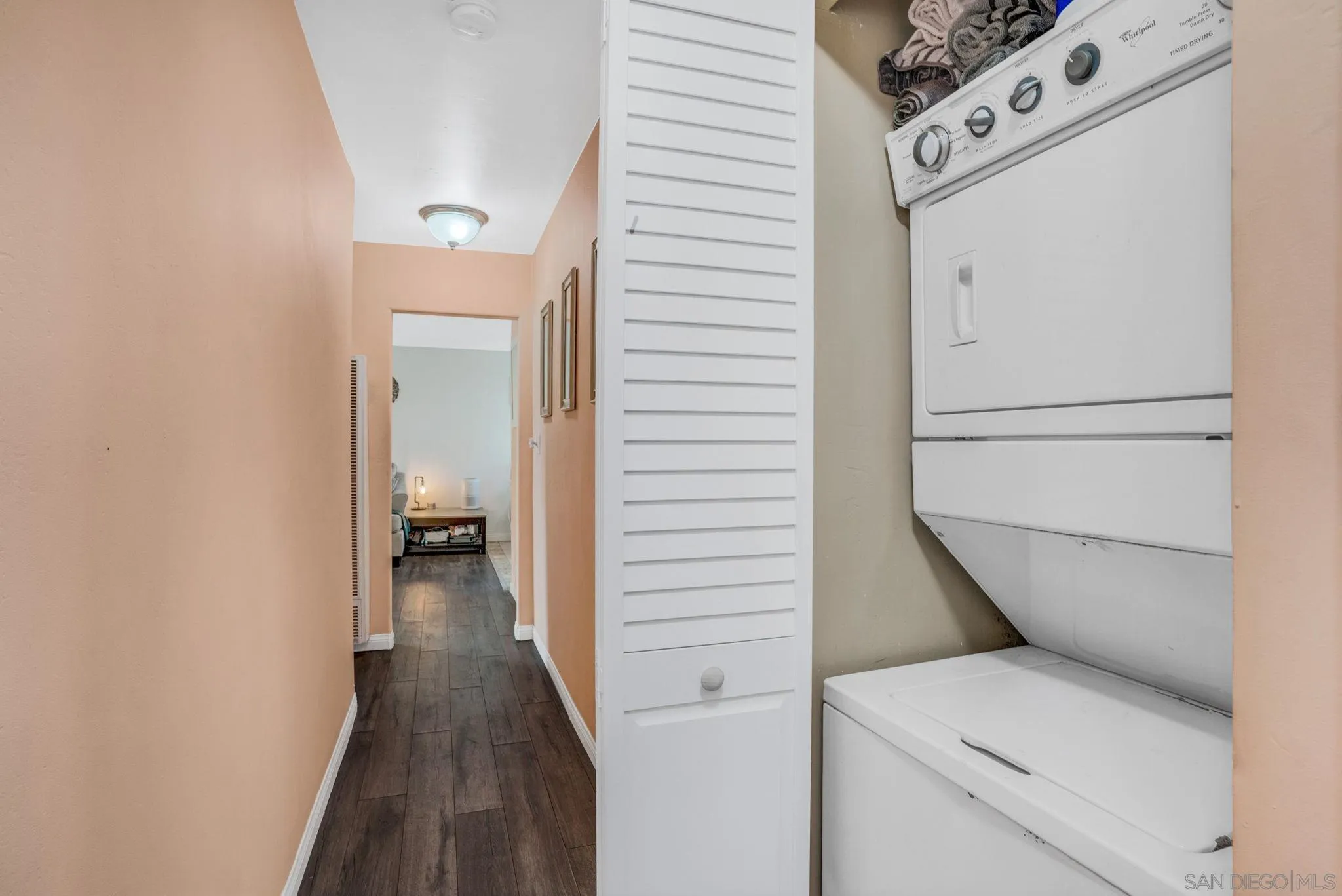 575 7th Street, Unit 104 Imperial Beach, CA 91932 - Photo 14 of 23 a view of a hallway with washer and dryer