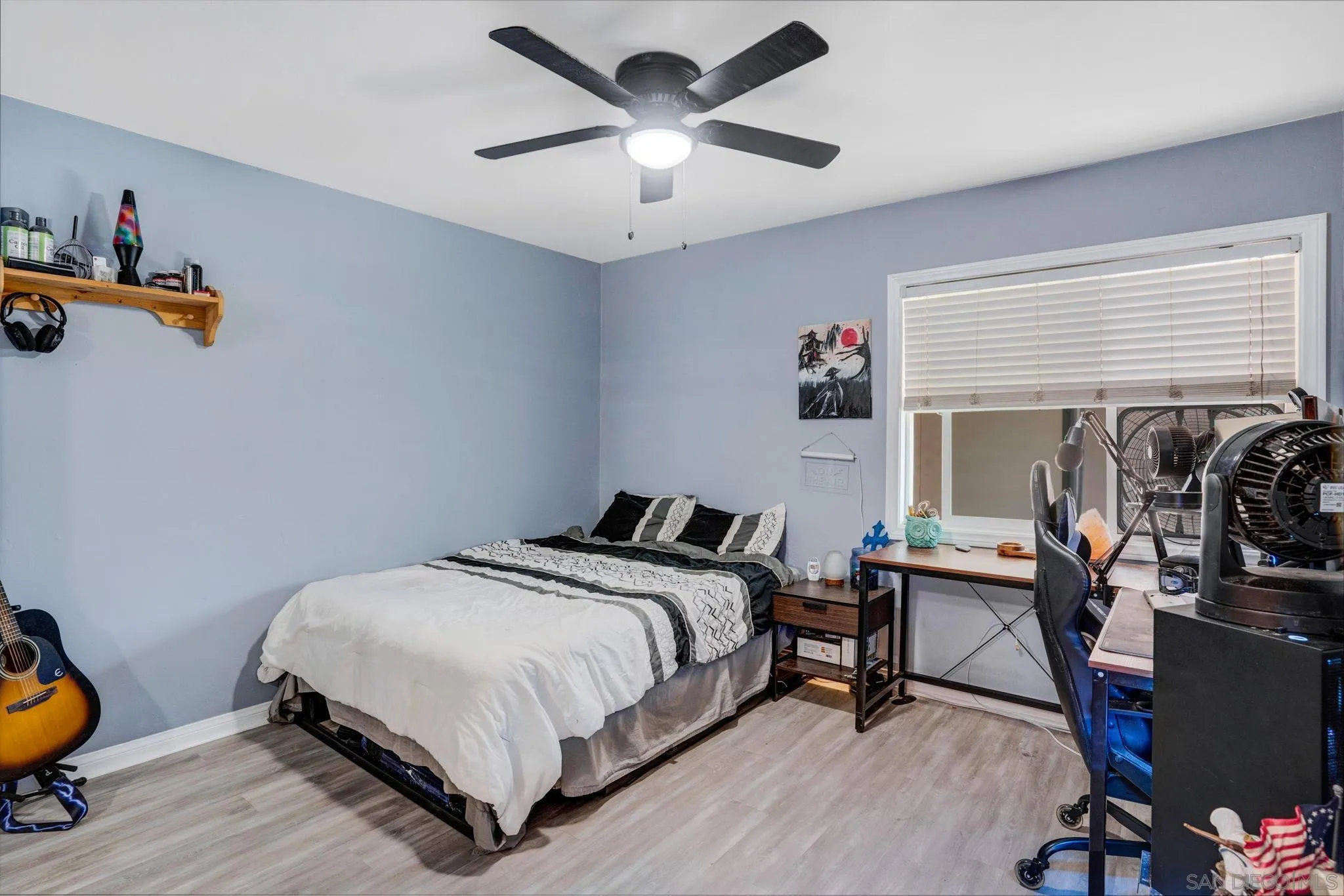 575 7th Street, Unit 104 Imperial Beach, CA 91932 - Photo 15 of 23 a bedroom with a bed and a chandelier