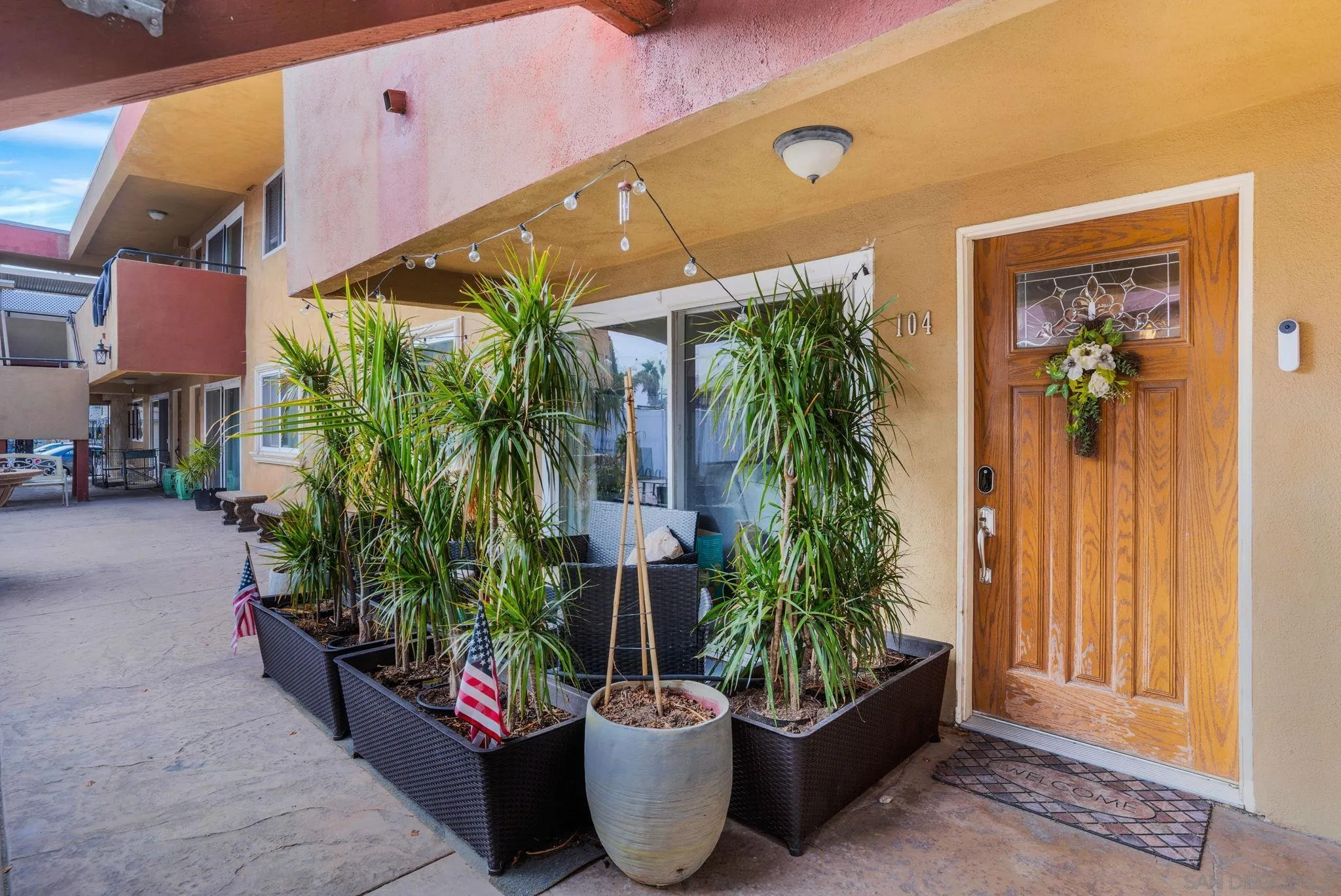 575 7th Street, Unit 104 Imperial Beach, CA 91932 - Photo 16 of 23 a potted plant sitting in front of a building
