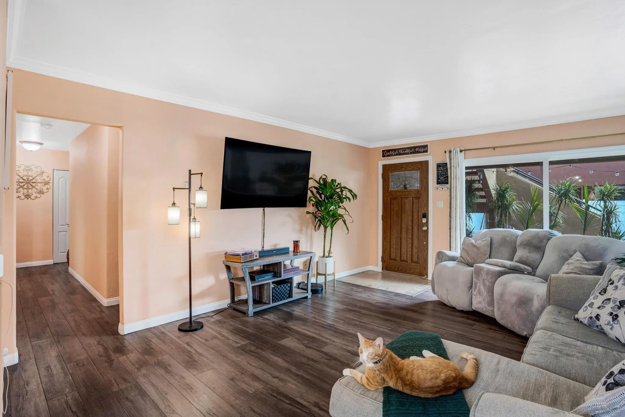 575 7th Street, Unit 104 Imperial Beach, CA 91932 - Photo 3 of 23 a living room with furniture and a flat screen tv