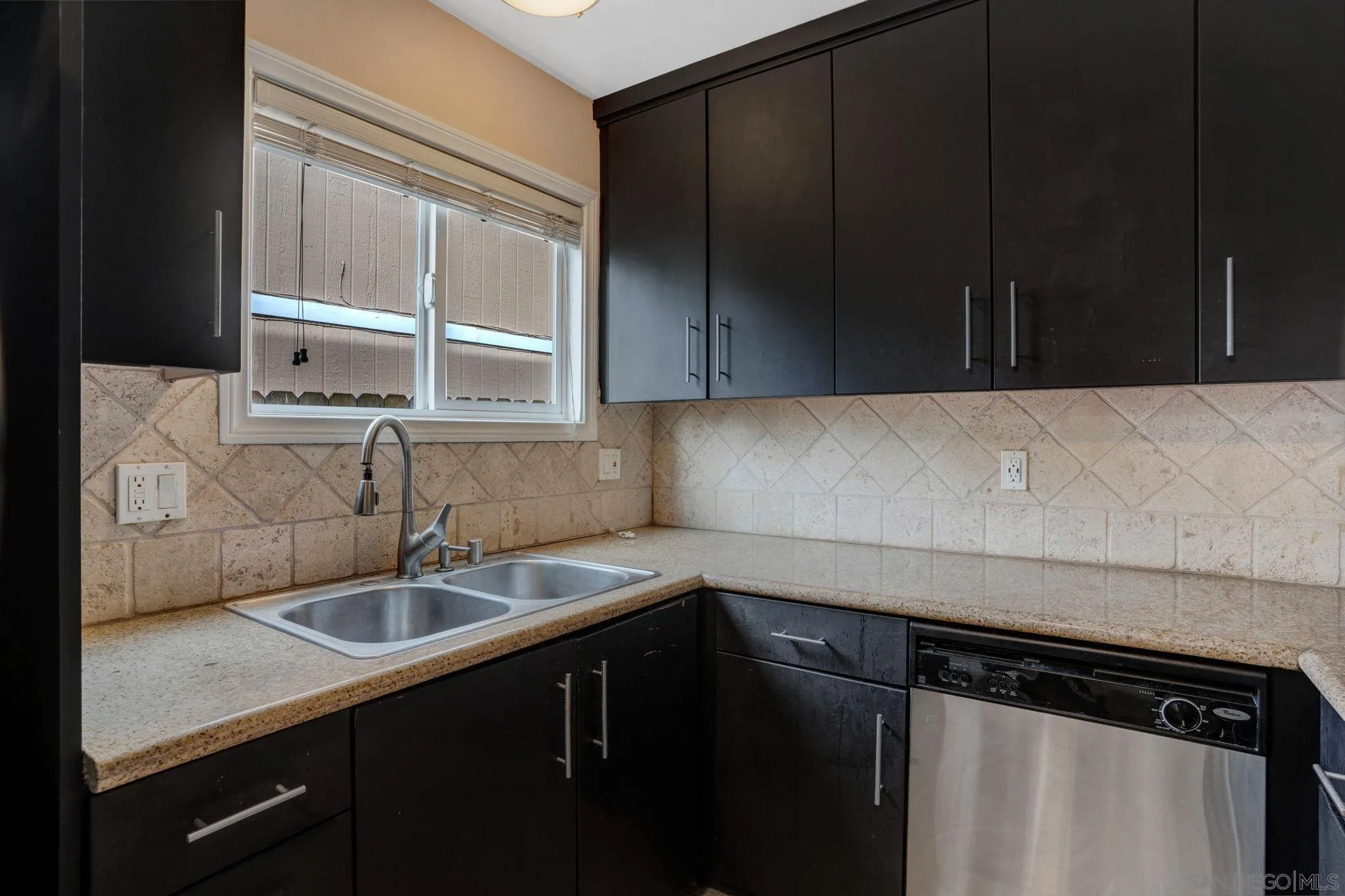 575 7th Street, Unit 104 Imperial Beach, CA 91932 - Photo 8 of 23 a kitchen with a sink and cabinets