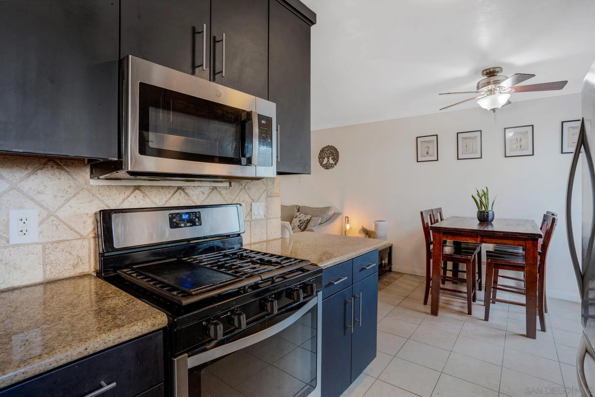 575 7th Street, Unit 104 Imperial Beach, CA 91932 - Photo 9 of 23 a kitchen with a stove and a microwave