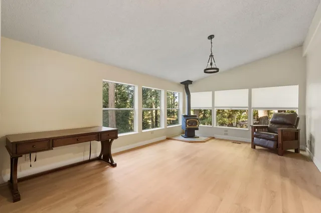 a view of a room with furniture windows and a chandelier