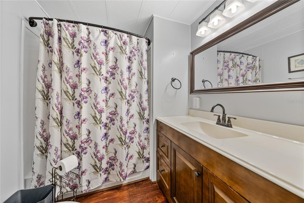1610 Reynolds Road, Unit 72 Lakeland, FL 33801 - Photo 15 of 25 a bathroom with a sink and a mirror