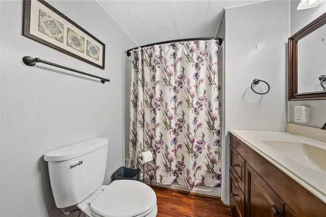 a white toilet sitting next to a bathroom sink