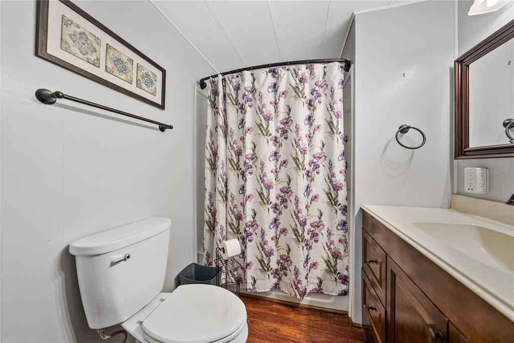 1610 Reynolds Road, Unit 72 Lakeland, FL 33801 - Photo 16 of 25 a white toilet sitting next to a bathroom sink