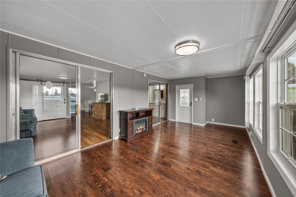 1610 Reynolds Road, Unit 72 Lakeland, FL 33801 - Photo 2 of 25 wooden floor in an empty room with a window