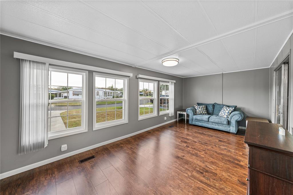 1610 Reynolds Road, Unit 72 Lakeland, FL 33801 - Photo 3 of 25 a living room with furniture and a large window