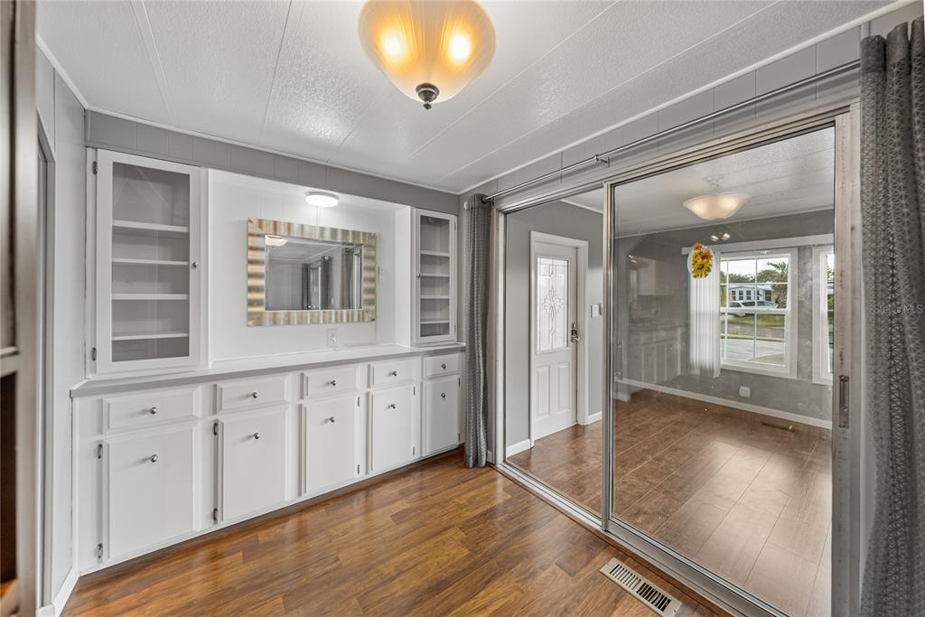 1610 Reynolds Road, Unit 72 Lakeland, FL 33801 - Photo 7 of 25 wooden floor in an empty room with a window