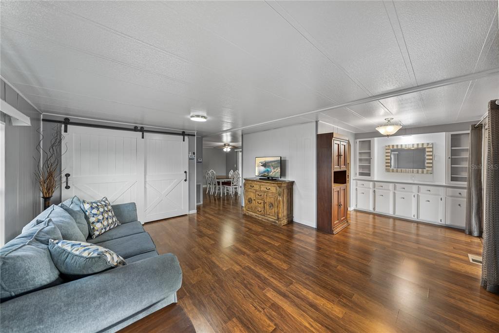 1610 Reynolds Road, Unit 72 Lakeland, FL 33801 - Photo 8 of 25 a living room with furniture and wooden floor