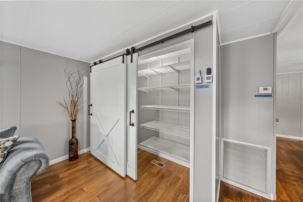 1610 Reynolds Road, Unit 72 Lakeland, FL 33801 - Photo 10 of 25 a room that has a bed and a glass door shower