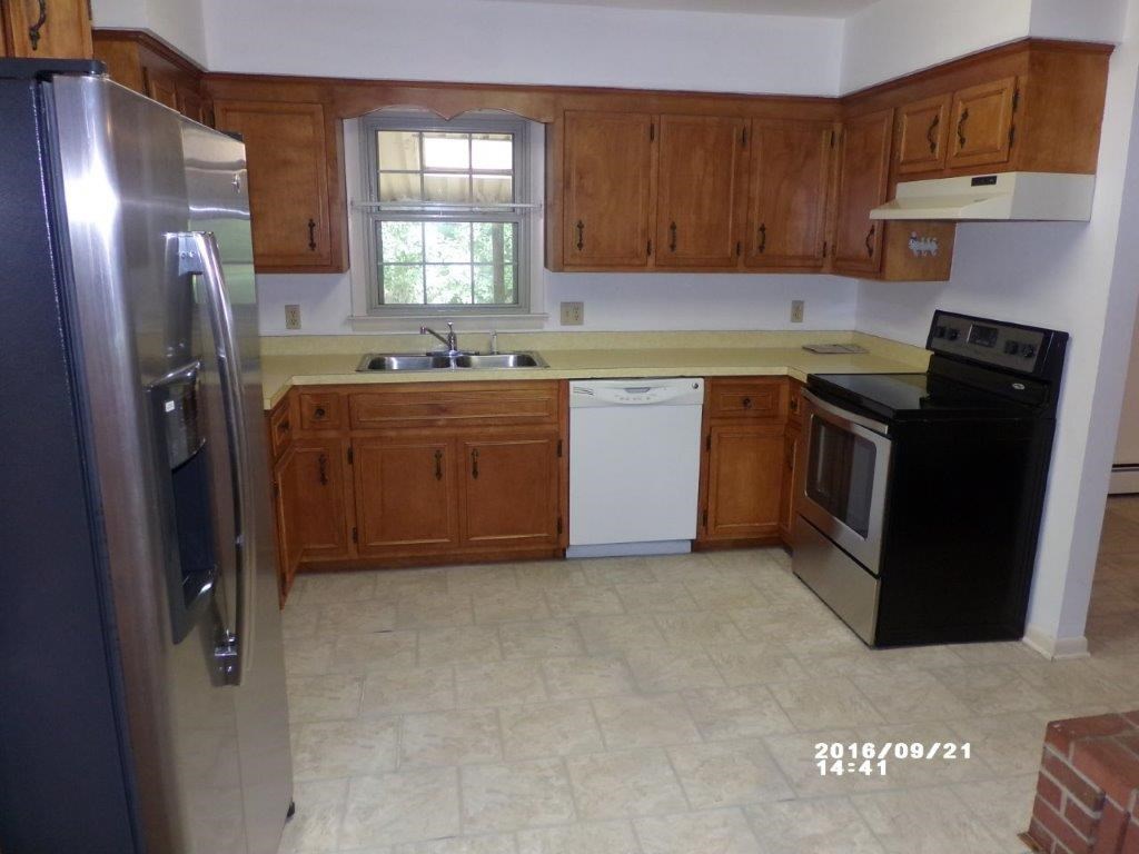 79 Chestnut Ridge Road Staunton, VA 24401 - Photo 11 of 24 a kitchen with stainless steel appliances granite countertop a refrigerator a stove a sink and a microwave