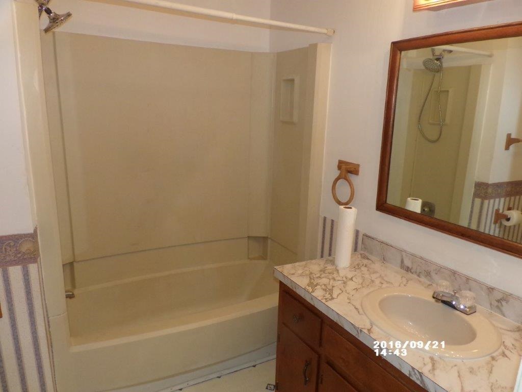 79 Chestnut Ridge Road Staunton, VA 24401 - Photo 12 of 24 a bathroom with a granite countertop sink and a mirror