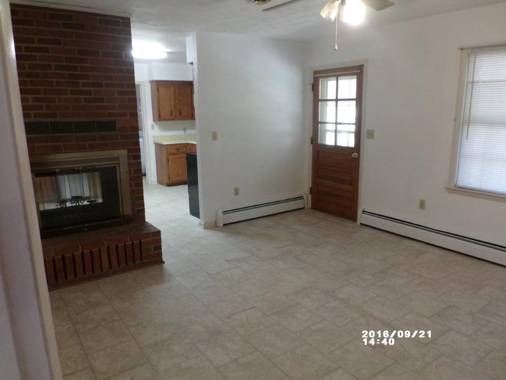 79 Chestnut Ridge Road Staunton, VA 24401 - Photo 15 of 24 an empty room with windows and fireplace