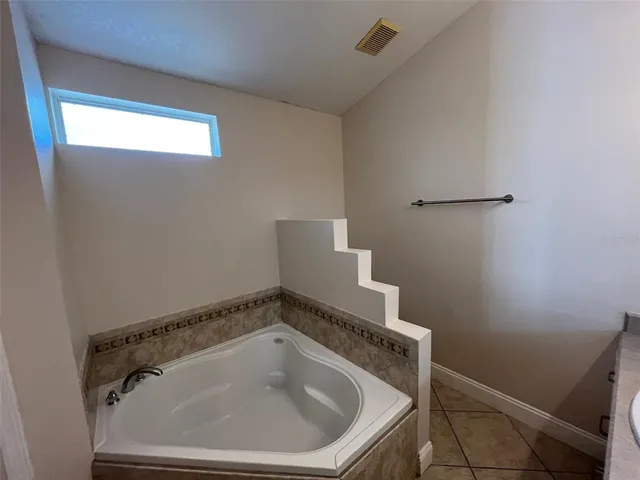 a bathroom with a sink and vanity