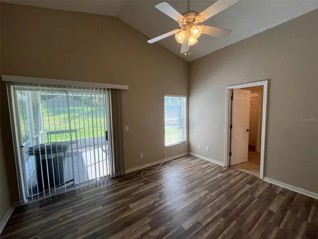 a view of livingroom with hardwood floor and ceiling fan