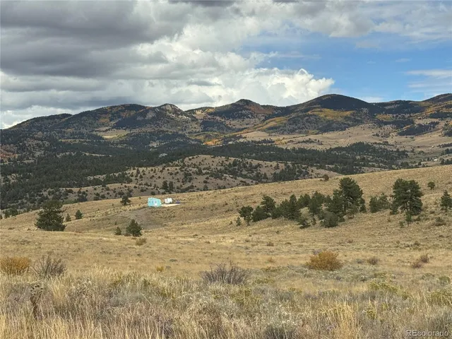 a front view of a house with parking area