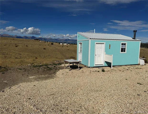 a bed room with a bed and a television