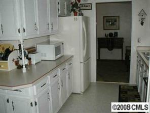 5536 Stack Road Monroe, NC 28112 - Photo 3 of 8 a kitchen with stainless steel appliances kitchen island a refrigerator sink and cabinets