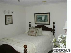 5536 Stack Road Monroe, NC 28112 - Photo 6 of 8 a bedroom with a bed and a painting on the wall