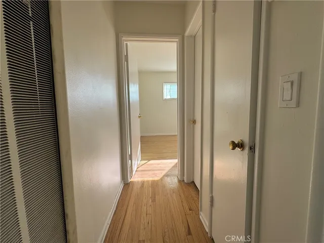 a view of a bathroom from a hallway