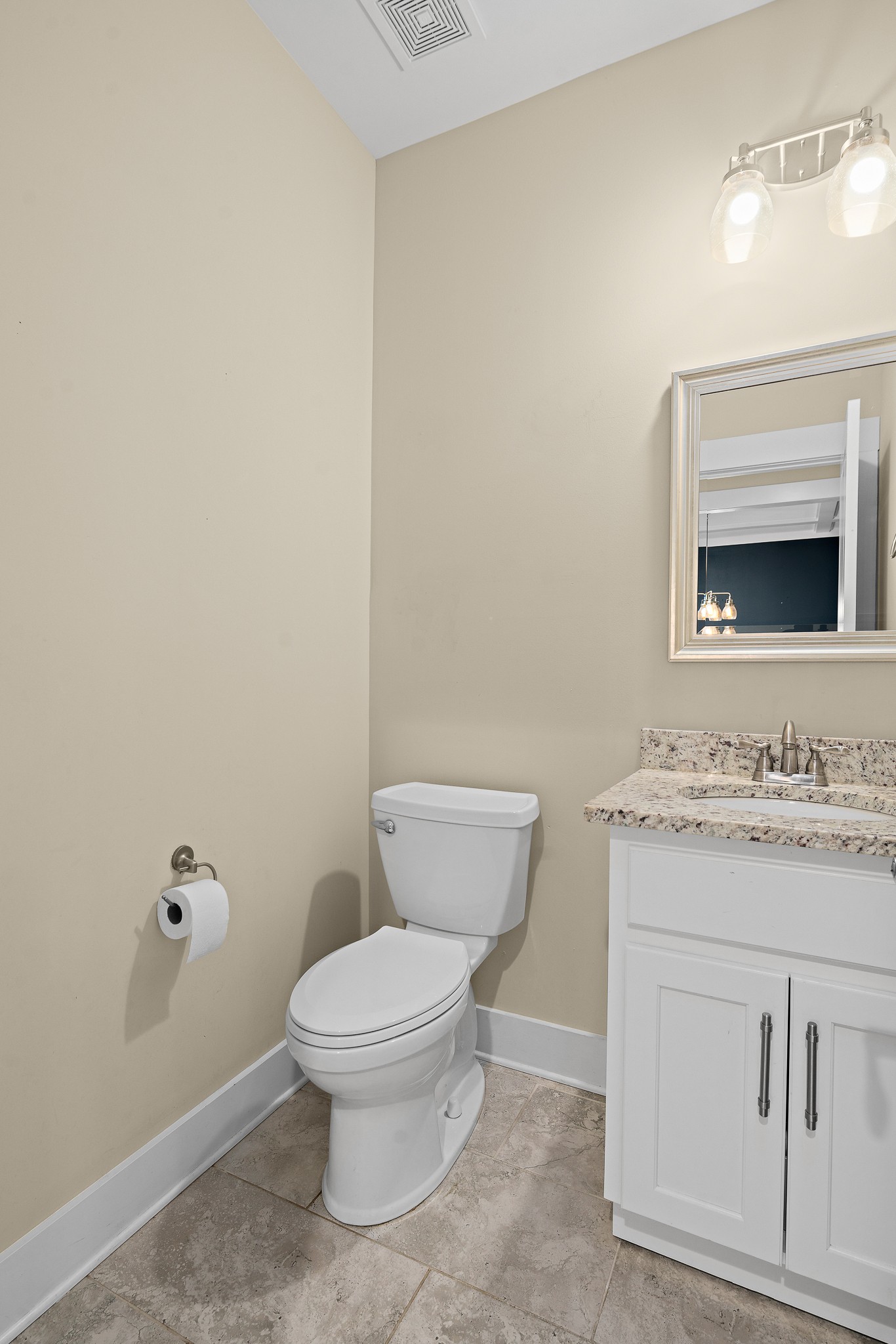 1105 Pegasus Run Lascassas, TN 37085 - Photo 20 of 48 a bathroom with a granite countertop toilet a sink and a mirror
