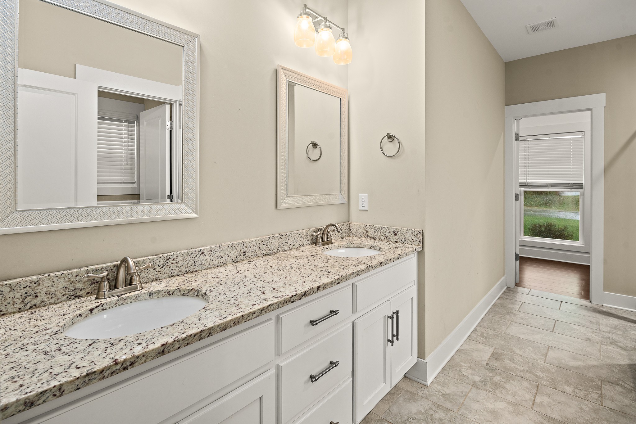 1105 Pegasus Run Lascassas, TN 37085 - Photo 23 of 48 a bathroom with a granite countertop sink double and mirror