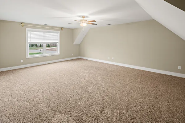 a view of a house with a yard and table