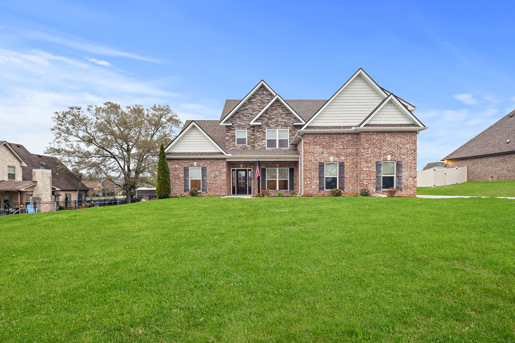 1105 Pegasus Run Lascassas, TN 37085 - Photo 3 of 48 a front view of a house with a yard and trees