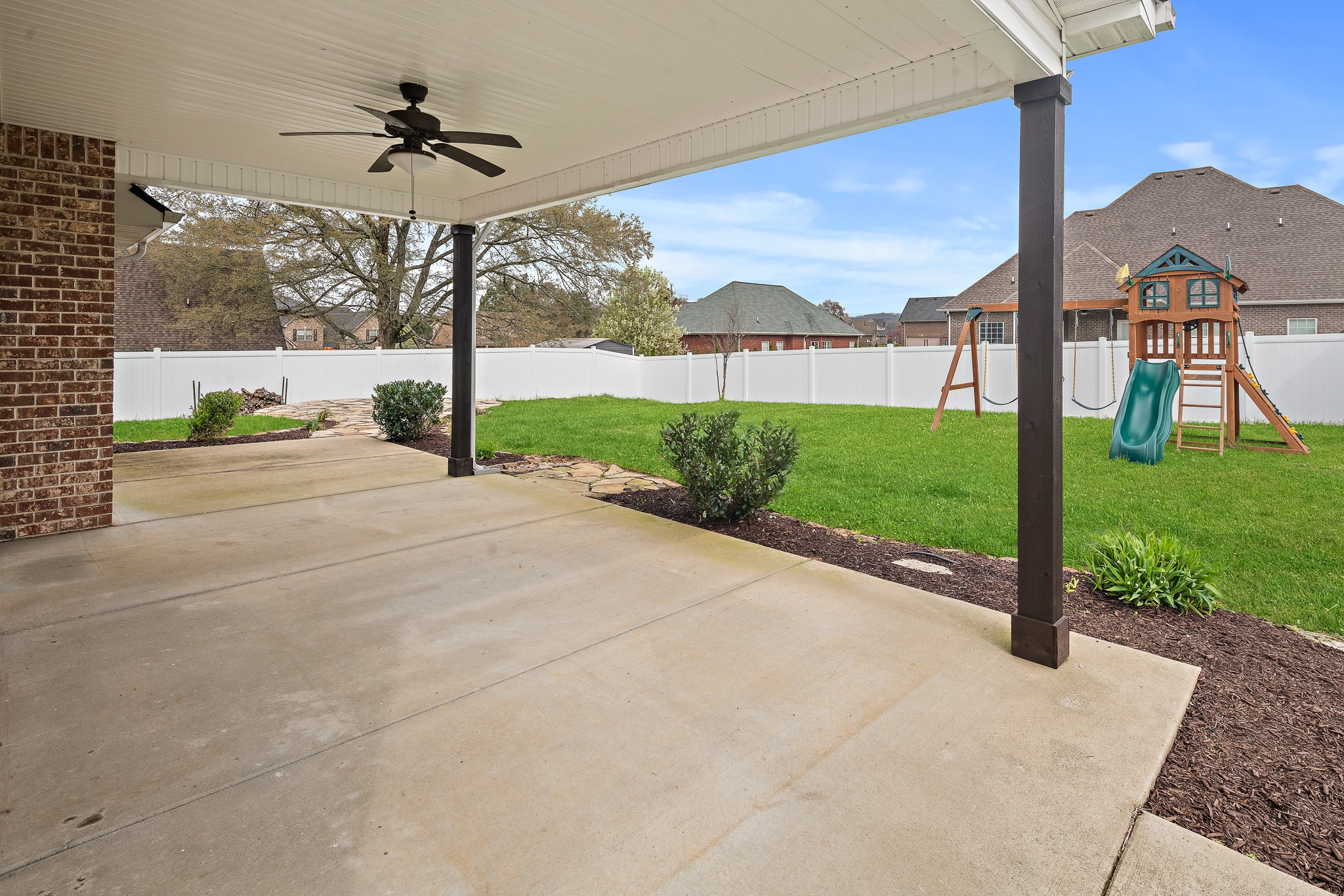 1105 Pegasus Run Lascassas, TN 37085 - Photo 38 of 48 a view of a house with a yard and table