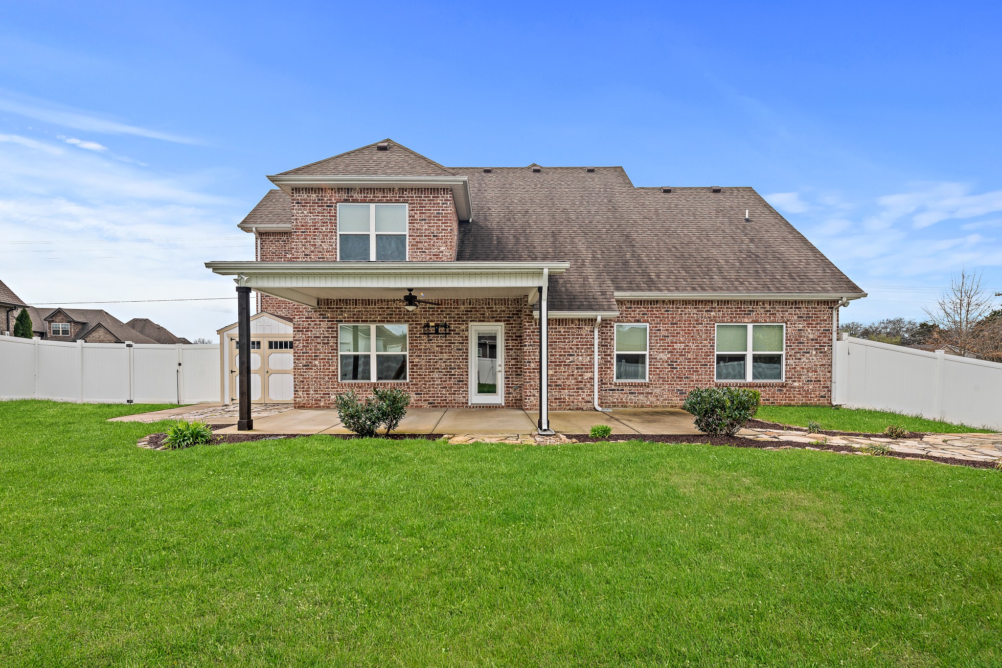 1105 Pegasus Run Lascassas, TN 37085 - Photo 45 of 48 a front view of a house with a yard and porch