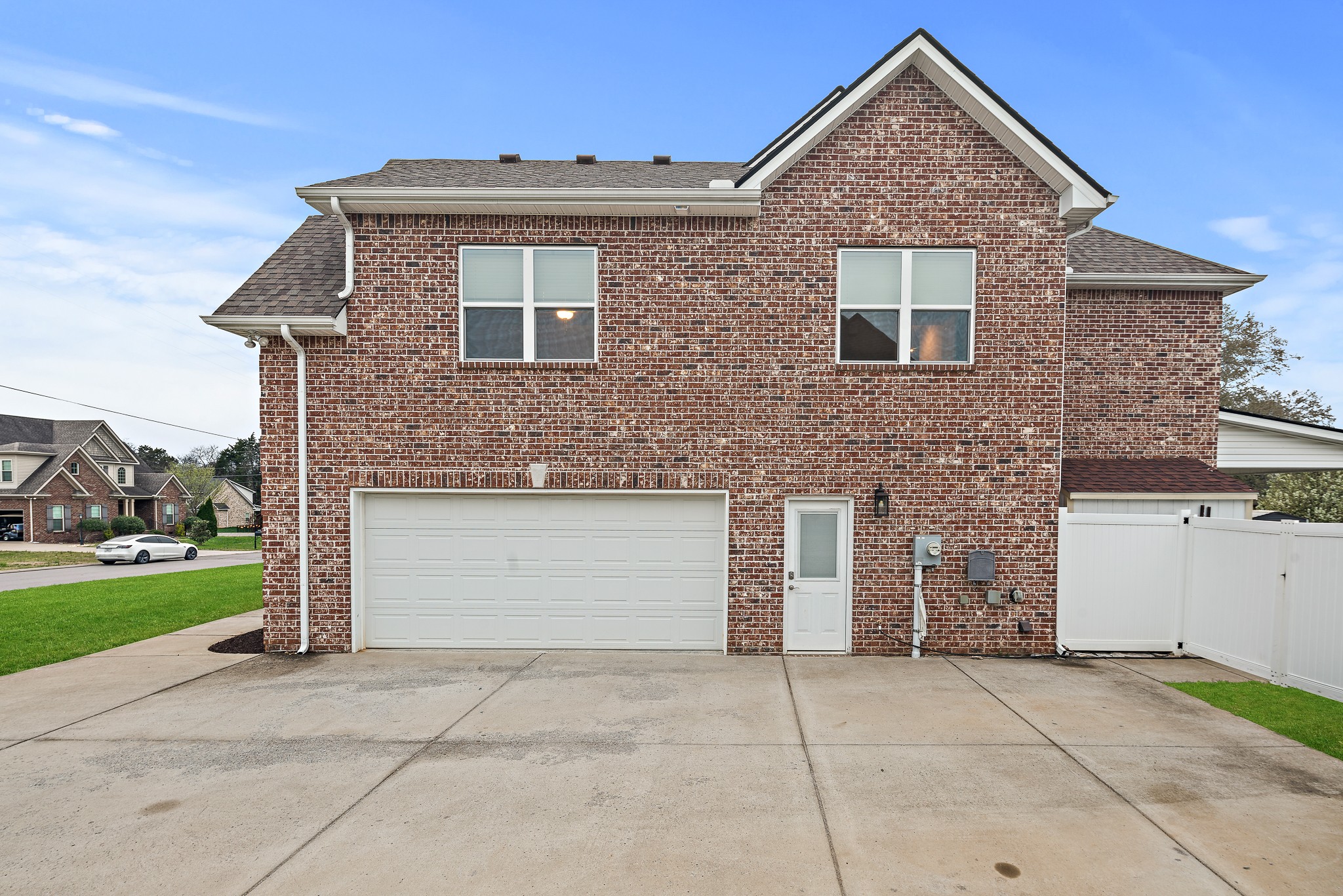 1105 Pegasus Run Lascassas, TN 37085 - Photo 47 of 48 a front view of a house with a yard and garage