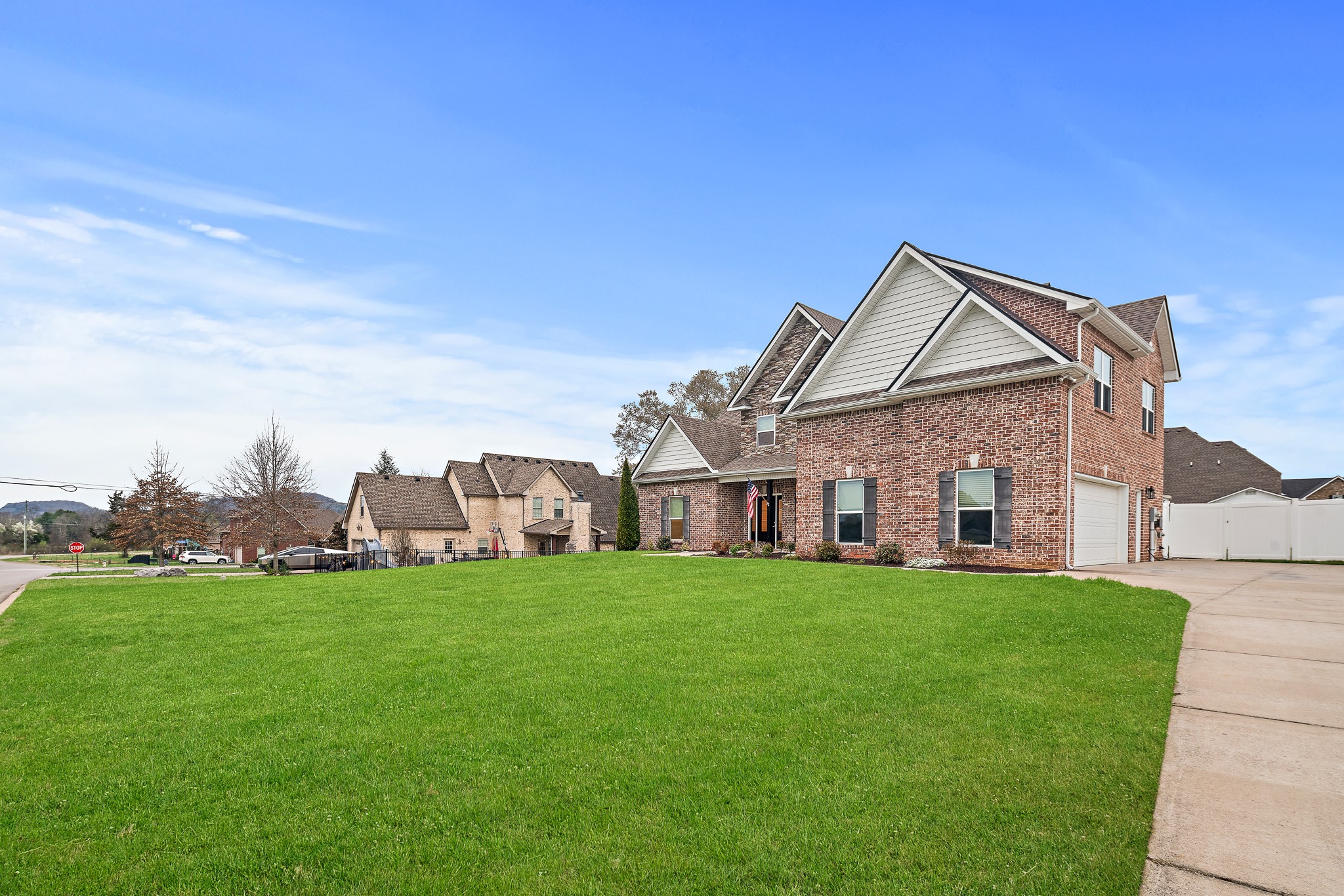 1105 Pegasus Run Lascassas, TN 37085 - Photo 5 of 48 a view of a house with a big yard and large trees