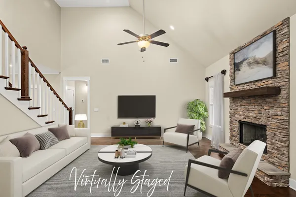 a kitchen with granite countertop white cabinets and stainless steel appliances