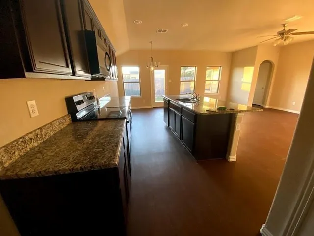 a view of livingroom and kitchen with furniture