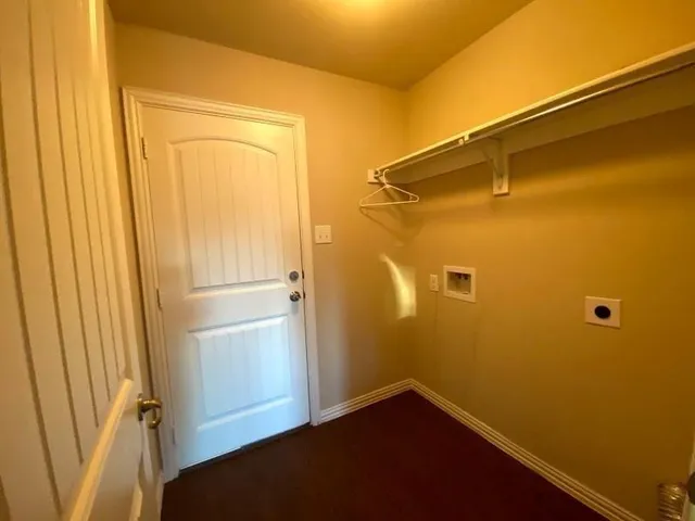 a kitchen with sink stove and cabinets