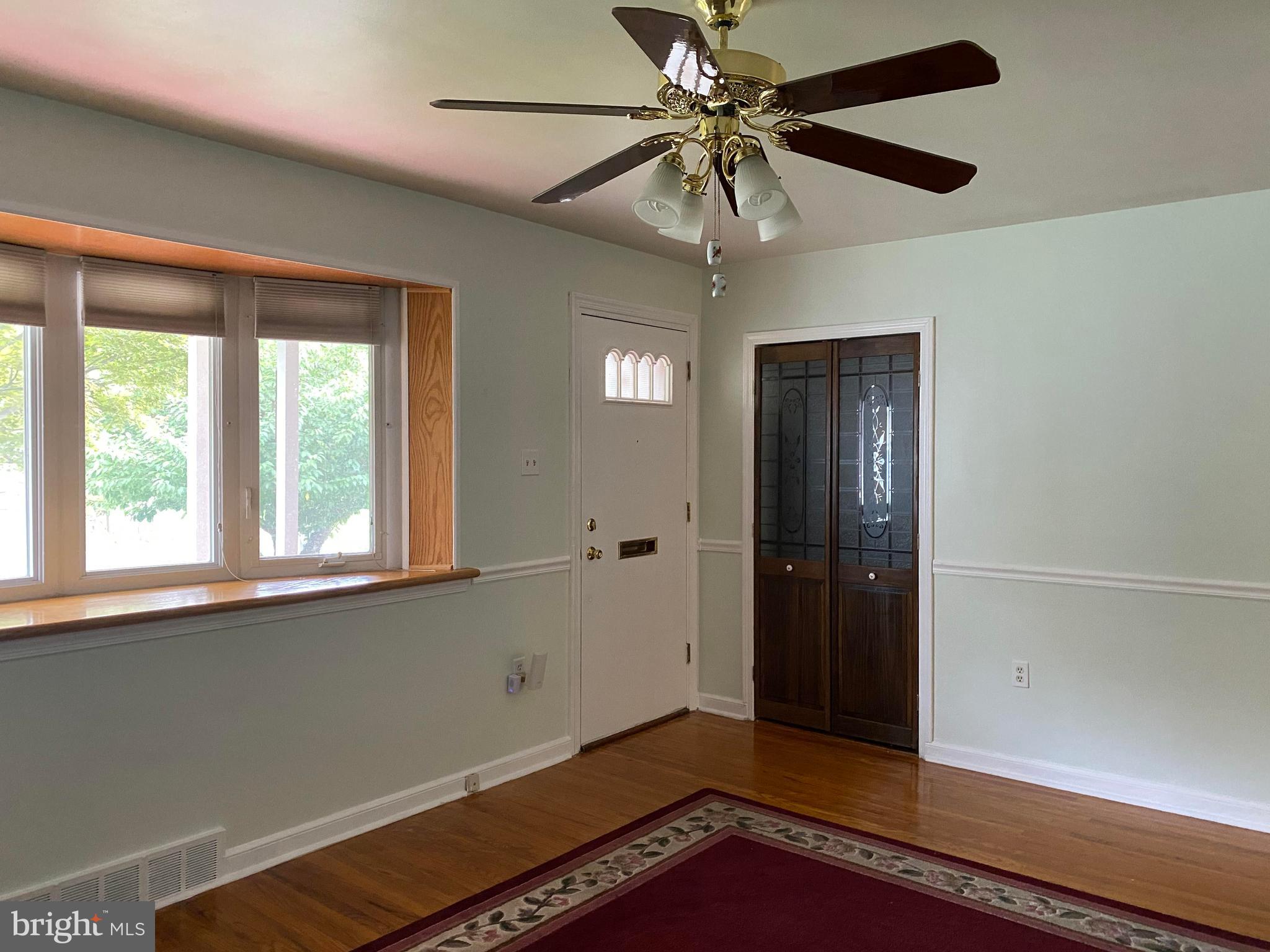 1827 Fuller Street Philadelphia, PA 19152 - Photo 8 of 36 Living Room- Front Door and Access Door to Attic