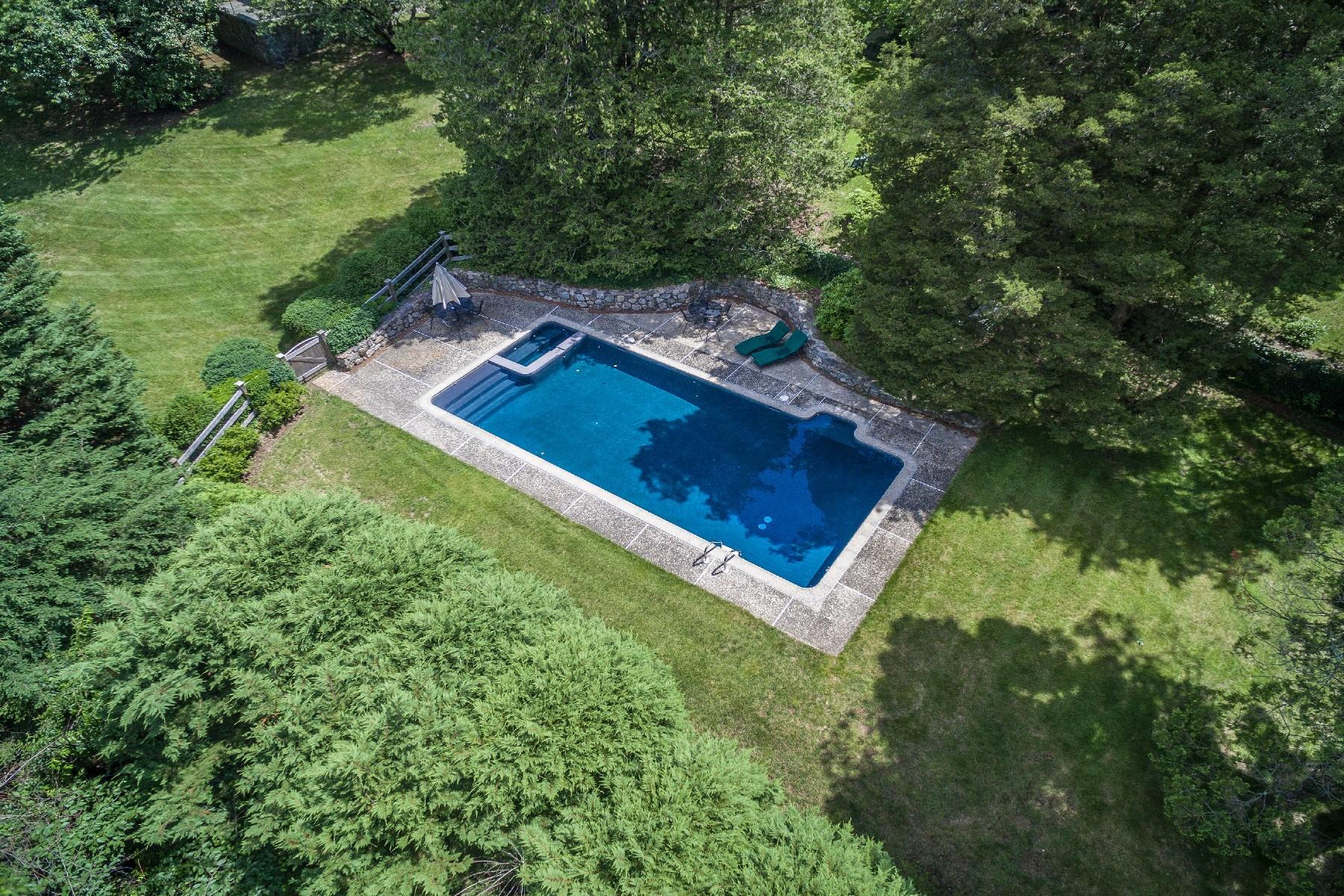 42 Old Farm Road Darien, CT 06820 - Photo 14 of 35 a view of a backyard with hardwood