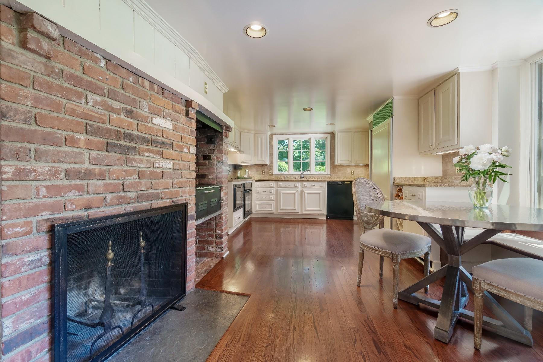 42 Old Farm Road Darien, CT 06820 - Photo 29 of 35 a living room with stainless steel appliances wooden floor and a fireplace