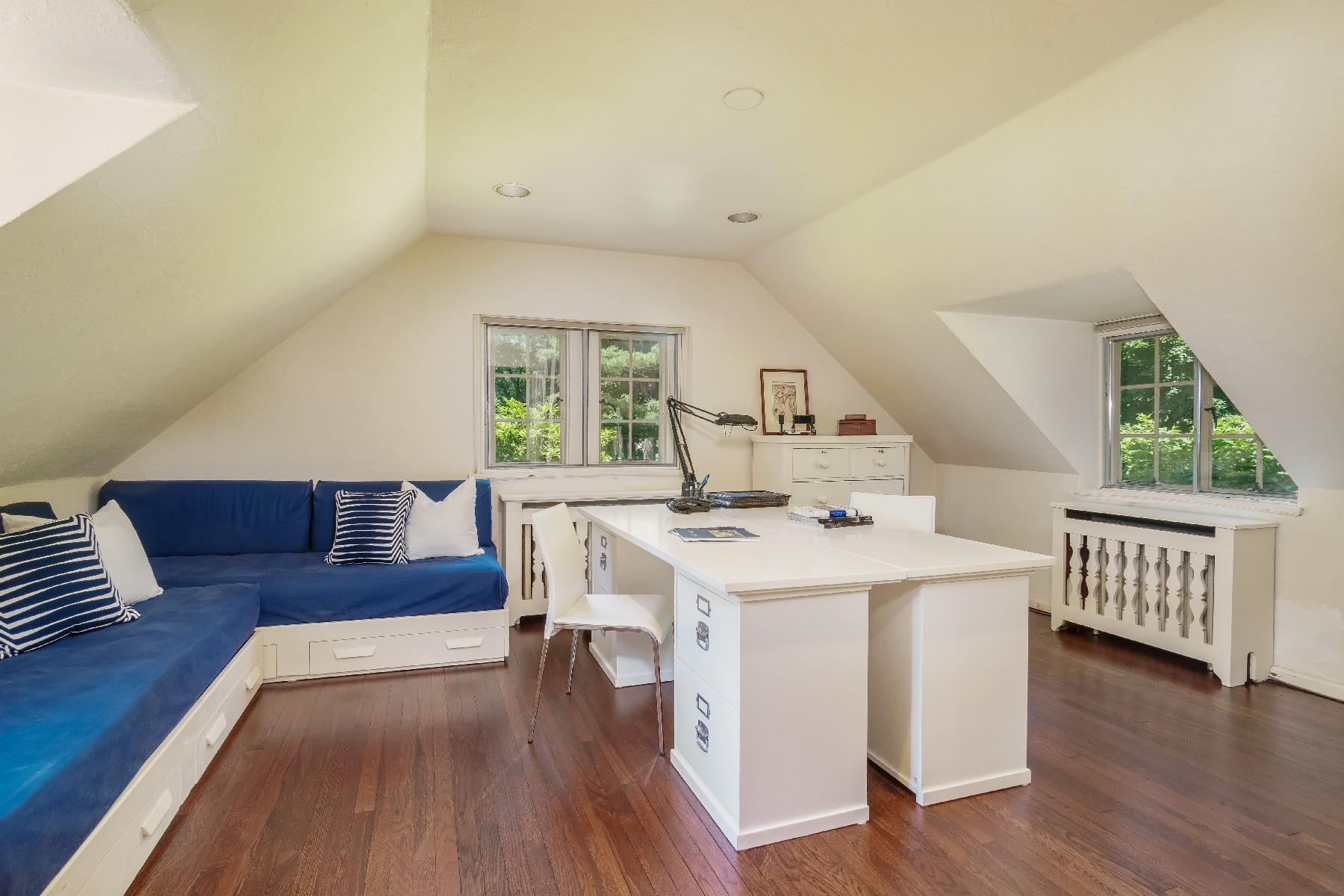 42 Old Farm Road Darien, CT 06820 - Photo 34 of 35 a living room with furniture and a wooden floor