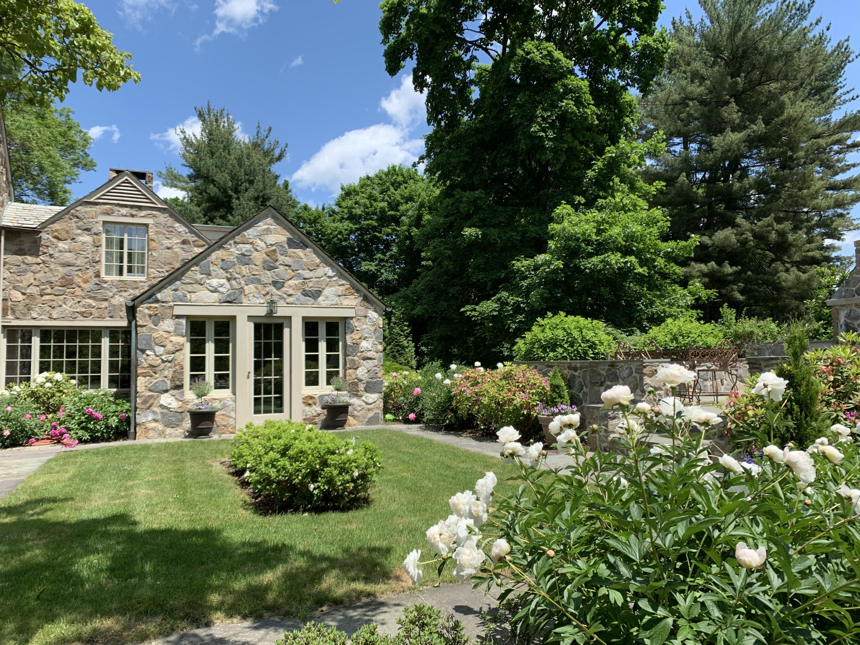 42 Old Farm Road Darien, CT 06820 - Photo 9 of 35 a front view of a house with a garden