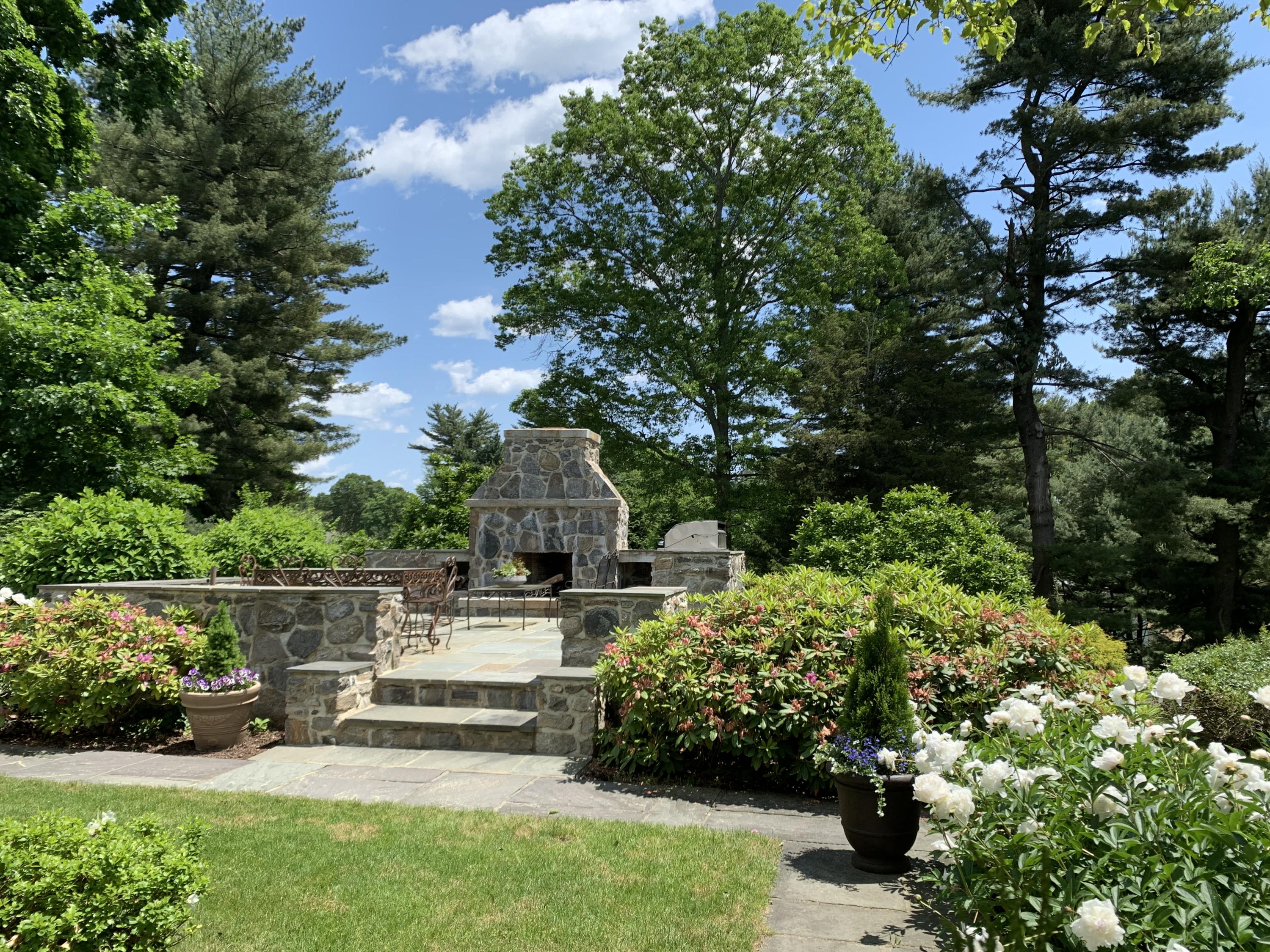 42 Old Farm Road Darien, CT 06820 - Photo 10 of 35 a view of a garden with a bench